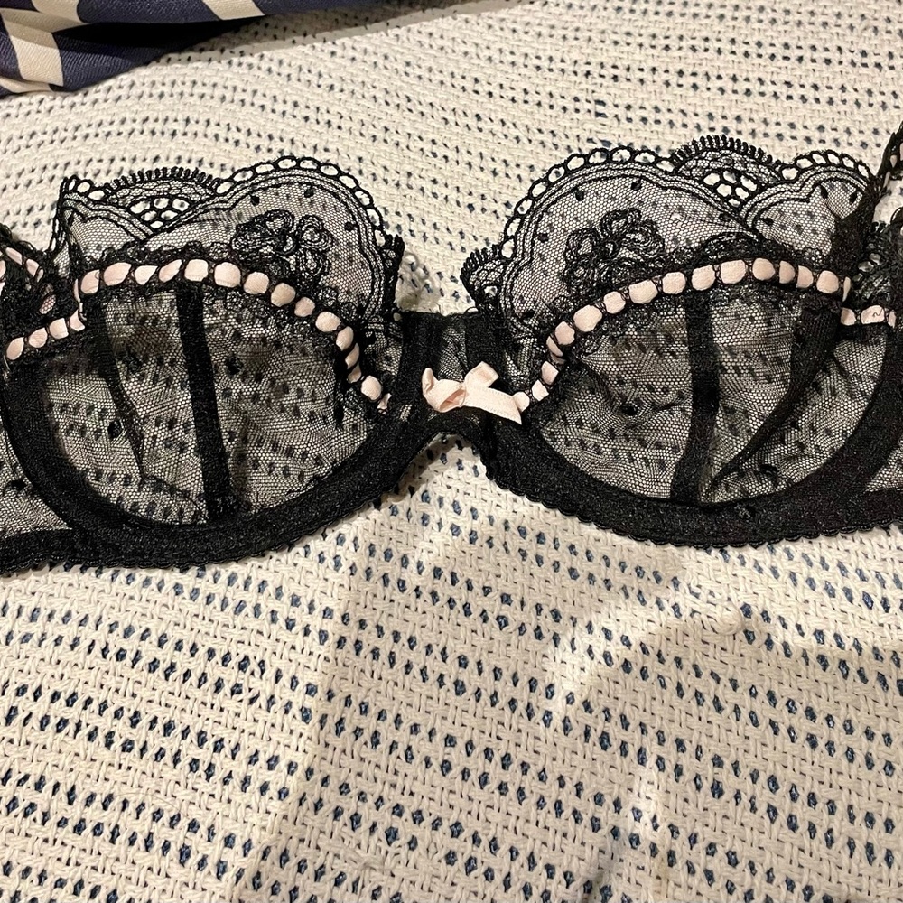 Black lace Agent Provocateur Bra with interwoven pink trim. size 32C